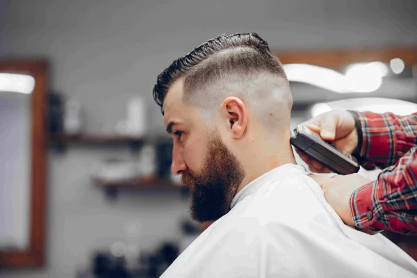 stylish-man-sitting-barbershop-1-scaled Haircuts